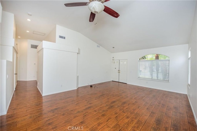 spare room featuring vaulted ceiling, dark hardwood / wood-style floors, and ceiling fan