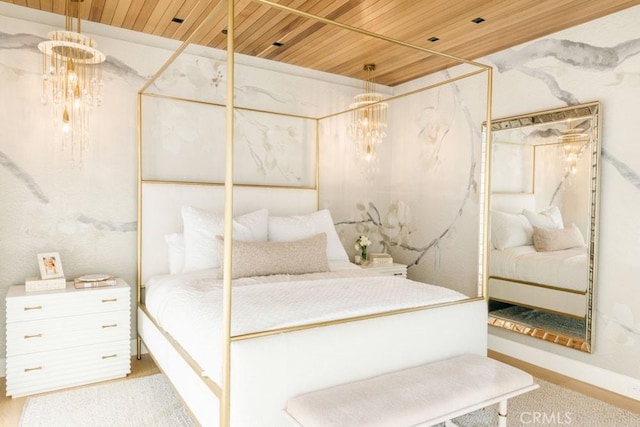 bedroom with wood ceiling and a notable chandelier
