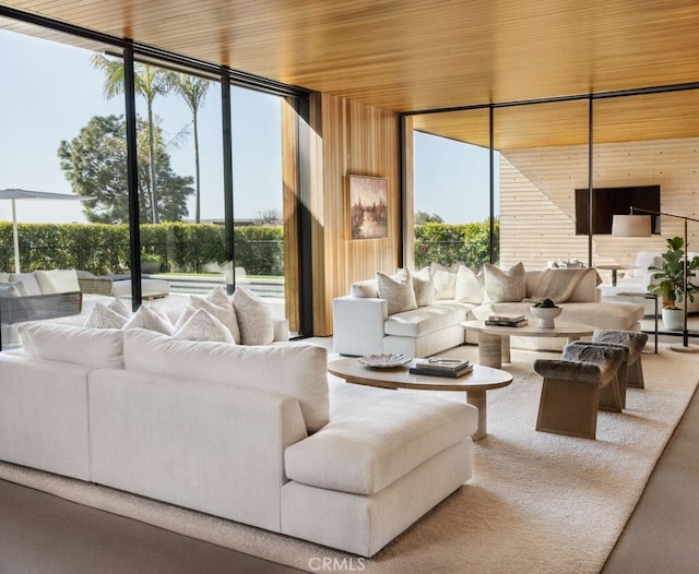 sunroom with a wealth of natural light and wooden ceiling