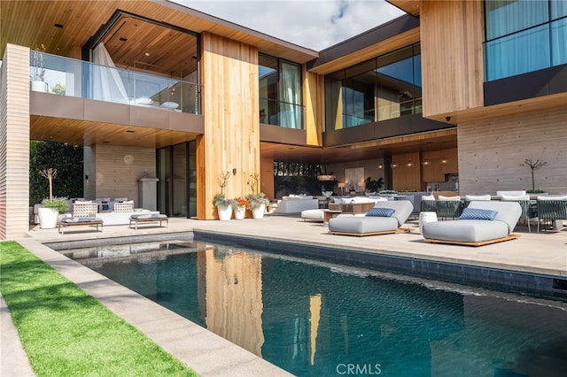 view of swimming pool with a patio area
