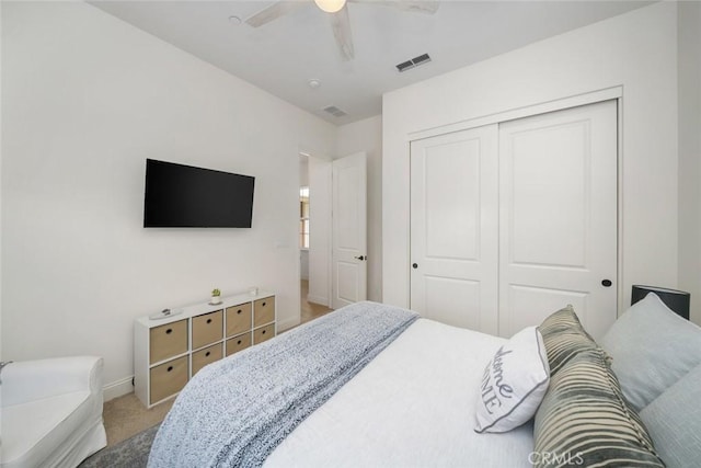 bedroom with carpet floors, a closet, and ceiling fan