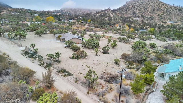 drone / aerial view featuring a mountain view