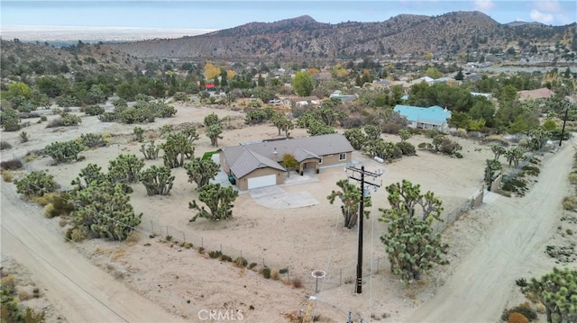 birds eye view of property featuring a mountain view