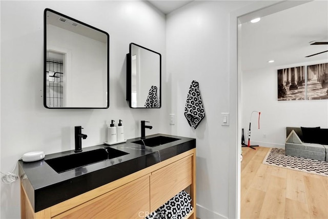 bathroom featuring vanity and hardwood / wood-style floors