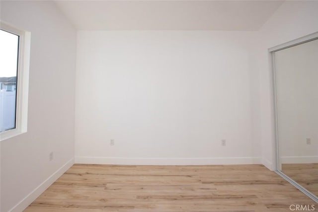 unfurnished room with light hardwood / wood-style floors