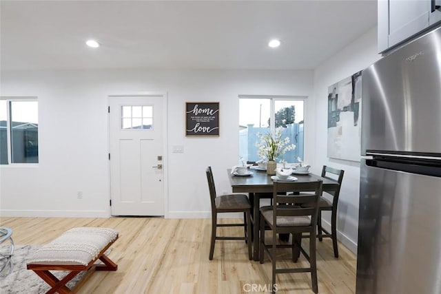 dining space with light wood-type flooring