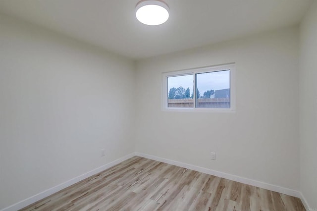 unfurnished room with light hardwood / wood-style flooring