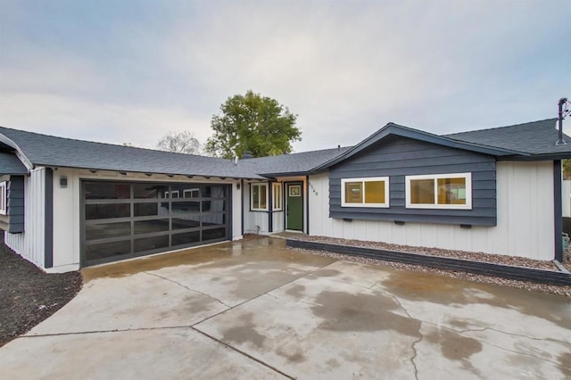 ranch-style home featuring a garage