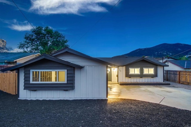 view of front facade with a mountain view and a patio