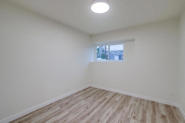 empty room with light hardwood / wood-style floors