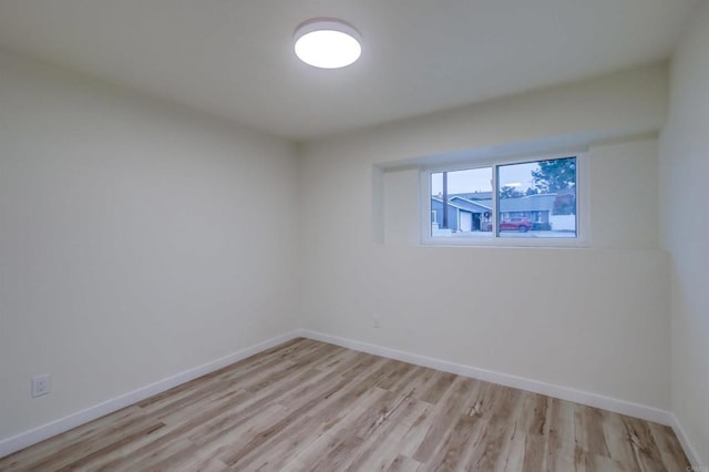 spare room with light wood-type flooring