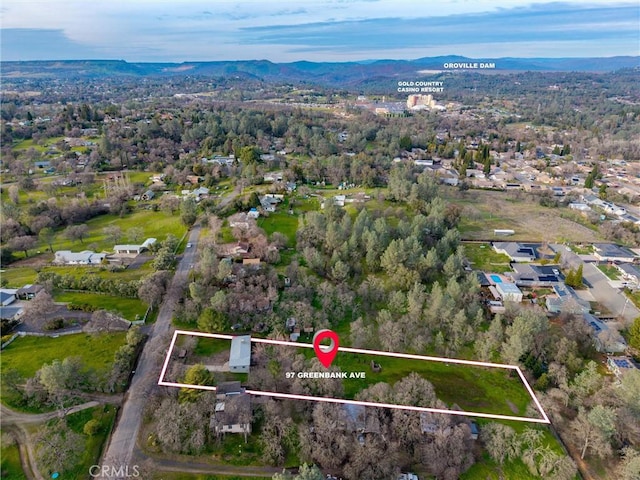 birds eye view of property featuring a mountain view