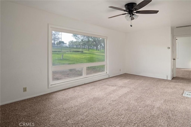 carpeted empty room with ceiling fan