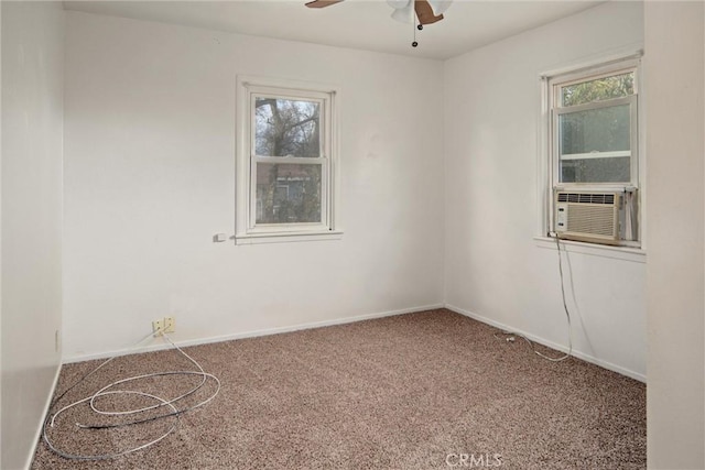 carpeted spare room featuring cooling unit and ceiling fan