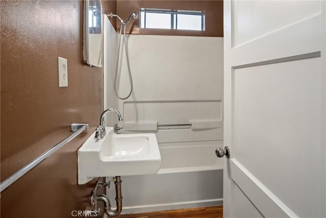 bathroom with sink and shower / tub combination