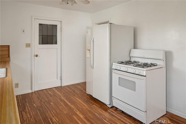 kitchen with dark wood-type flooring, white range with gas stovetop, and ceiling fan