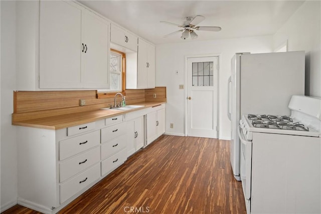 kitchen featuring dark hardwood / wood-style floors, sink, white cabinets, white range with gas cooktop, and ceiling fan