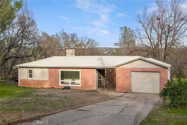 single story home featuring a garage