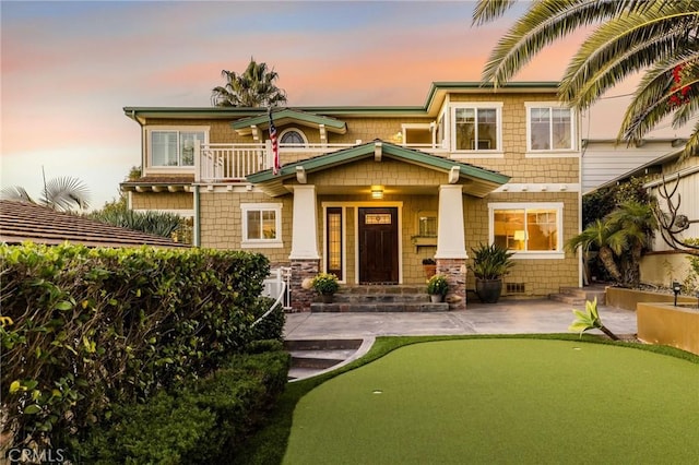 31777 5th Ave, Laguna Beach, CA 92651 - view of front of house featuring an area to practice putting, a balcony, and a patio area