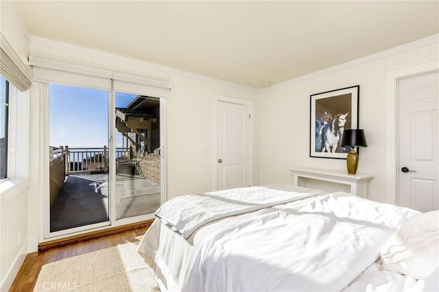 31777 5th Ave, Laguna Beach, CA 92651 - bedroom featuring wood finished floors, crown molding, and access to outside