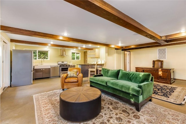 living room with beamed ceiling and visible vents