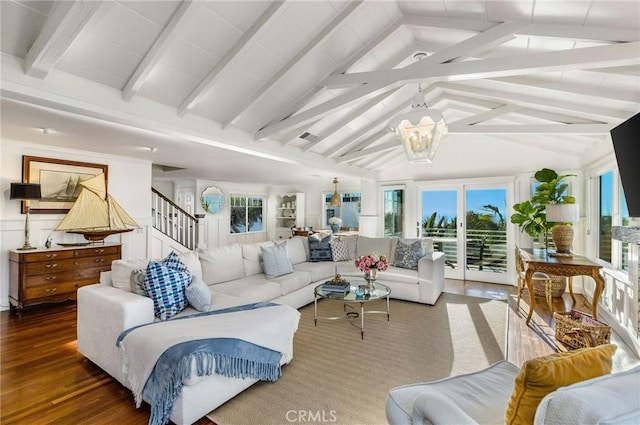 sunroom / solarium with a chandelier and vaulted ceiling with beams