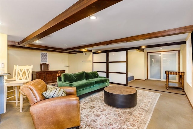 living area with recessed lighting, beamed ceiling, and baseboards