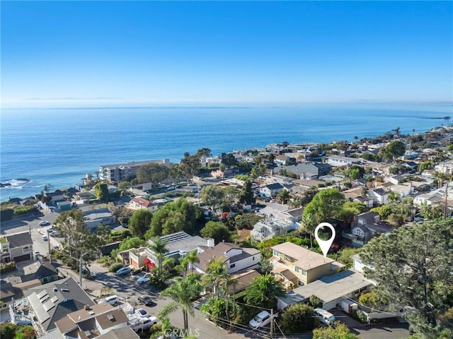 drone / aerial view featuring a residential view and a water view