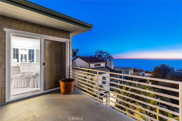 balcony featuring a water view