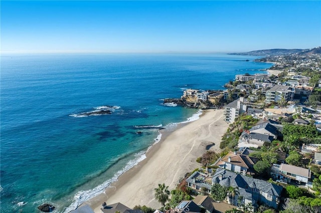 aerial view featuring a view of the beach and a water view