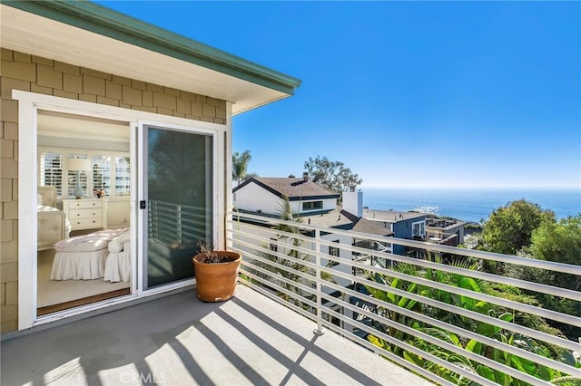 balcony featuring a water view