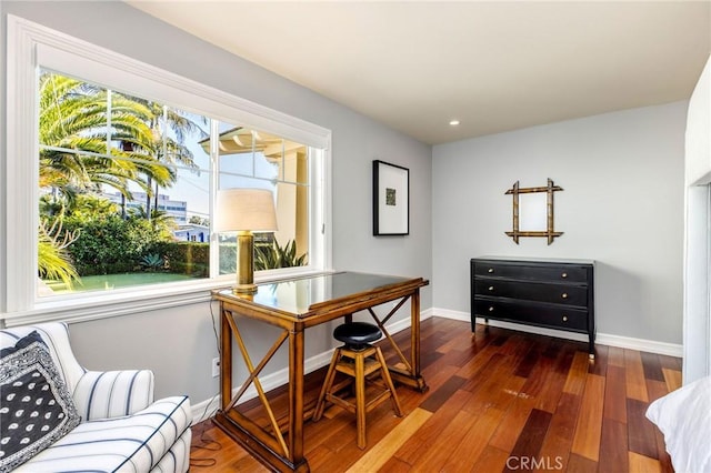 office featuring recessed lighting, baseboards, and wood finished floors