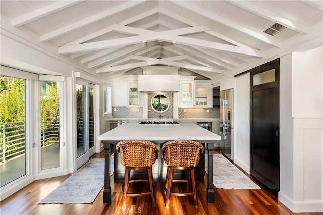 31777 5th Ave, Laguna Beach, CA 92651 - kitchen with high quality fridge, gas stovetop, light countertops, and dark wood finished floors