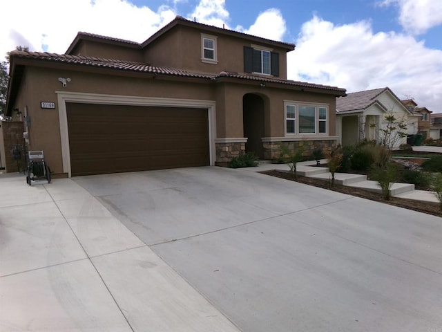 mediterranean / spanish-style home featuring a garage