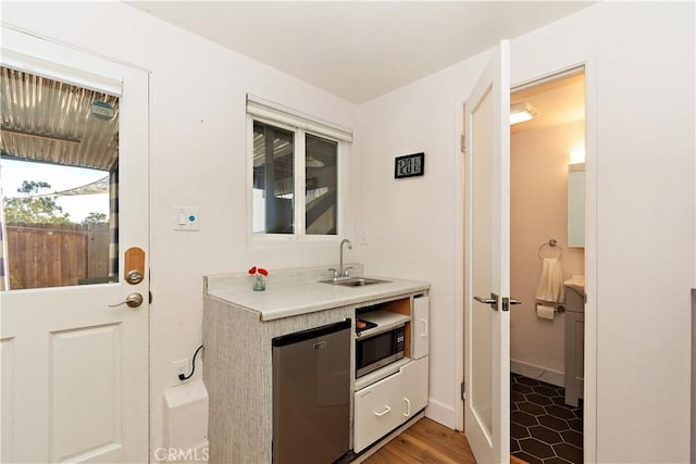 kitchen featuring stainless steel appliances and sink