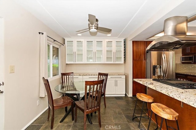 dining room with ceiling fan