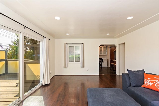 unfurnished living room featuring dark hardwood / wood-style floors