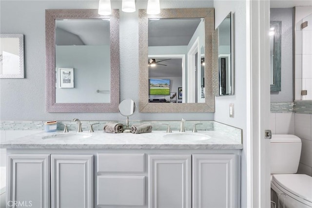 bathroom with vanity and toilet