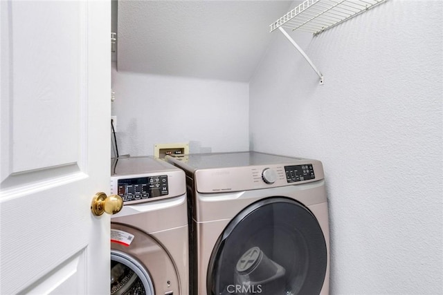 laundry room with washer and dryer