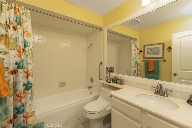 full bath featuring shower / bath combo, vanity, toilet, and tile patterned floors