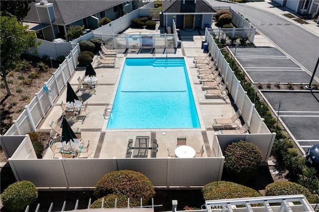 pool featuring a patio area and fence