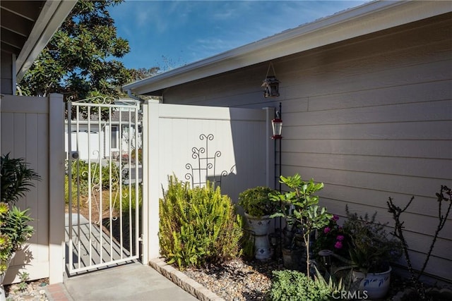 view of gate with fence