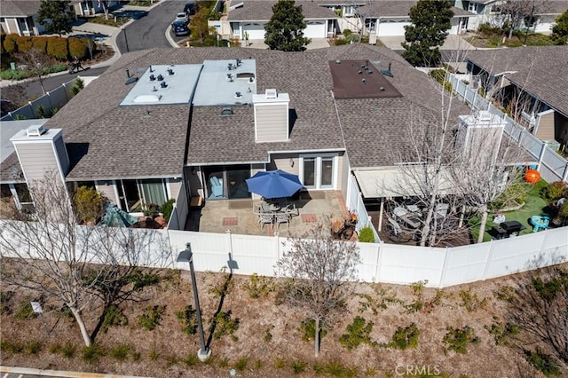 birds eye view of property with a residential view