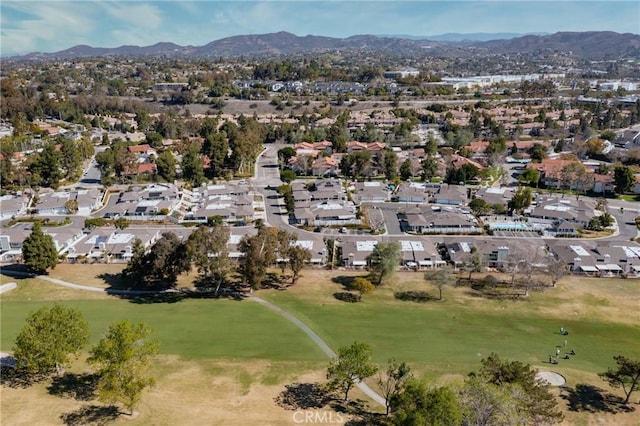 bird's eye view featuring a residential view, view of golf course, and a mountain view