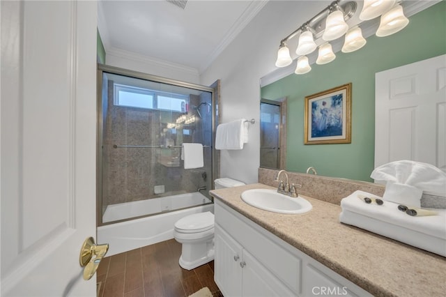 bathroom featuring shower / bath combination with glass door, crown molding, toilet, vanity, and wood finished floors