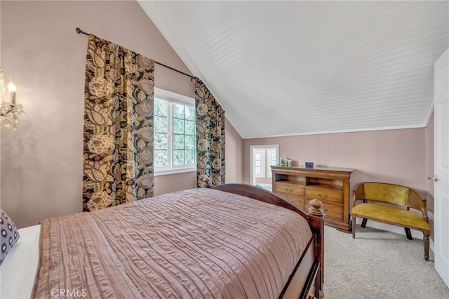 carpeted bedroom with lofted ceiling