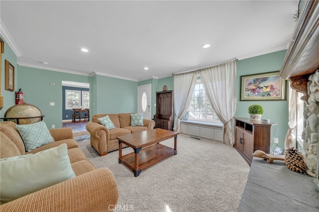 living area with crown molding, recessed lighting, visible vents, and a healthy amount of sunlight