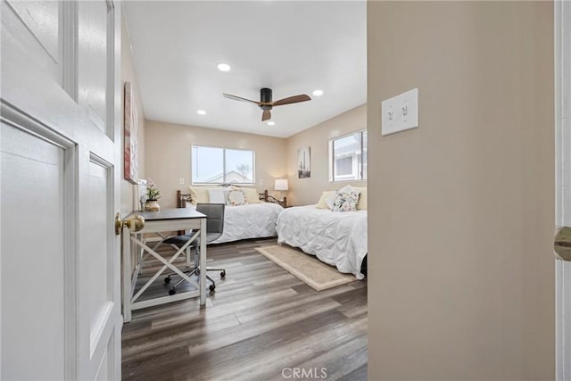 bedroom with hardwood / wood-style flooring and ceiling fan