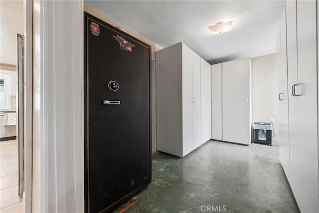 hallway featuring concrete flooring