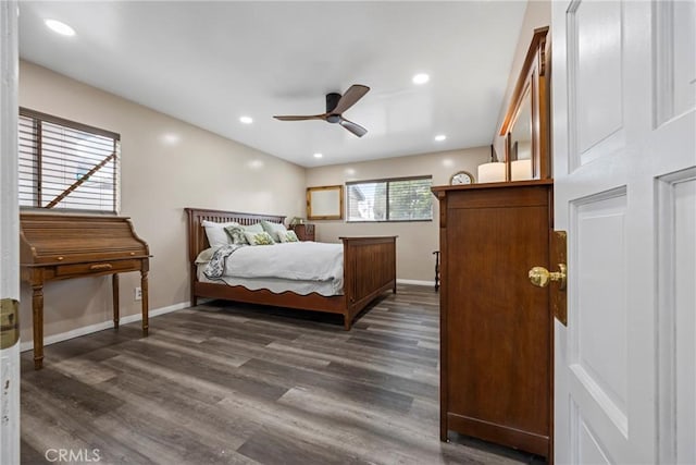 bedroom with dark hardwood / wood-style flooring